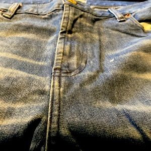 Packing distressed blue denim stacked skinny jeans